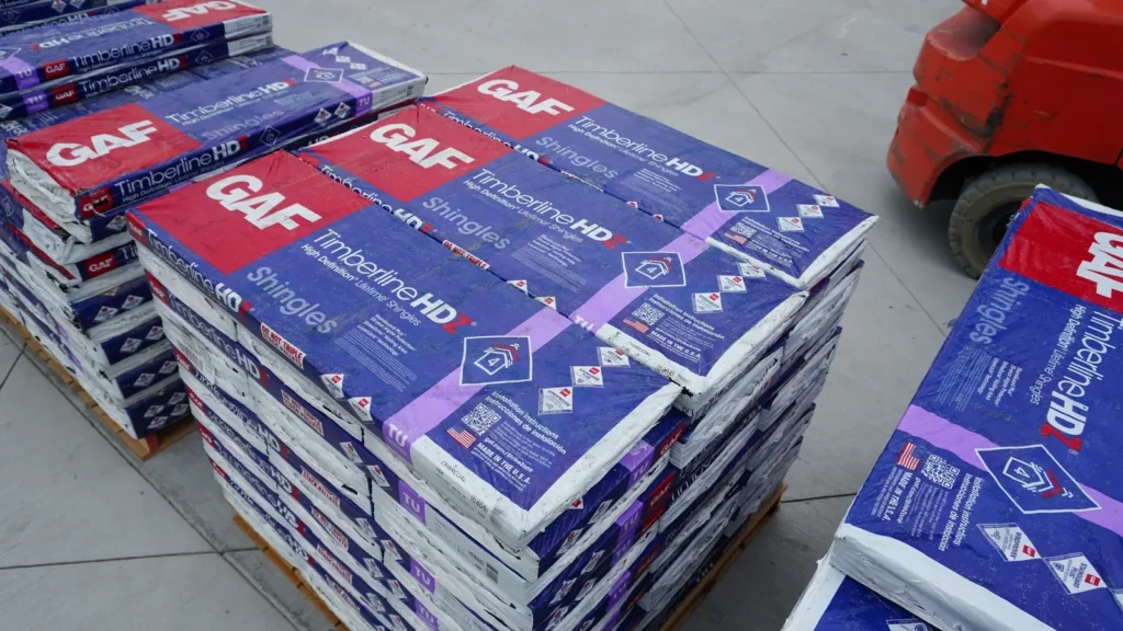 GAF Timberline HDZ shingle bundles stacked in the supply yard.